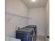 Laundry room with washer, dryer, and overhead shelving at 45 Knight Ln, Mcdonough, GA 30252