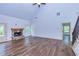 Spacious living room with hardwood floors and a stone fireplace at 45 Knight Ln, Mcdonough, GA 30252