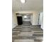 Open basement space with kitchen and flooring at 3571 Quail Hollow Trl, Snellville, GA 30039