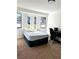 Cozy bedroom with window seat and carpeted floor at 3571 Quail Hollow Trl, Snellville, GA 30039