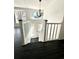 Bright entryway with staircase, chandelier, and dark hardwood floors at 3571 Quail Hollow Trl, Snellville, GA 30039