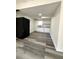 Basement kitchen with white cabinets and black fridge at 3571 Quail Hollow Trl, Snellville, GA 30039