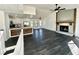 Open floorplan living area with kitchen and fireplace at 3571 Quail Hollow Trl, Snellville, GA 30039