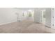 Large Gathering room with neutral carpeting and plenty of natural light at 6288 Village Arbor Ln, Mableton, GA 30126