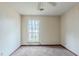 Simple bedroom with large window and ceiling fan at 396 Independence Dr, Jonesboro, GA 30238