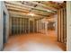 Unfinished basement with framed rooms and open space at 2201 E Maddox Rd, Buford, GA 30519