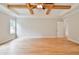 Large bedroom with hardwood floors and window views at 2201 E Maddox Rd, Buford, GA 30519