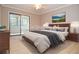 Virtually staged bedroom with king-size bed and access to a private balcony at 407 Coleraine Se # 407, Smyrna, GA 30080