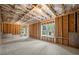 Unfinished basement with exposed framing and window at 5635 Mercedes Dr, Cumming, GA 30041