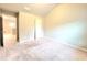 Spacious bedroom with carpet and access to hallway at 1947 Castleberry Ln, Buford, GA 30518