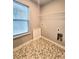 Laundry room with hexagon tile floor and window at 1947 Castleberry Ln, Buford, GA 30518