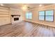 Spacious living room with built-in shelving and hardwood floors at 1947 Castleberry Ln, Buford, GA 30518