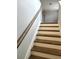 Modern staircase with dark wood treads and white risers at 1947 Castleberry Ln, Buford, GA 30518