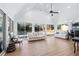 Sunroom with vaulted ceiling, hardwood floors, and pool view at 450 Shadowlawn Se Rd, Marietta, GA 30067