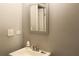 Small bathroom with gray walls and a simple sink at 1026 Valley View Rd, Atlanta, GA 30315