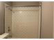 Clean bathroom with white tile shower surround at 1026 Valley View Rd, Atlanta, GA 30315