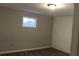 Spacious bedroom with gray walls and a window at 1026 Valley View Rd, Atlanta, GA 30315