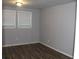 Simple bedroom with gray walls and hardwood-style floors at 1026 Valley View Rd, Atlanta, GA 30315