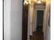 Long hallway with dark brown barn door and light gray walls at 1026 Valley View Rd, Atlanta, GA 30315