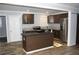 Modern kitchen with dark cabinets, granite counters and island at 1026 Valley View Rd, Atlanta, GA 30315