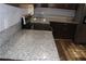 Kitchen boasts granite countertops and dark brown cabinets at 1026 Valley View Rd, Atlanta, GA 30315