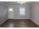 Spacious living room featuring hardwood floors and neutral walls at 1026 Valley View Rd, Atlanta, GA 30315