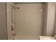 Clean subway tiled shower with a handheld shower head at 1026 Valley View Rd, Atlanta, GA 30315