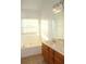 Bathroom with double vanity, bathtub and tile floors at 321 Whitney Ln, Mcdonough, GA 30253
