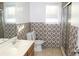 Bathroom with patterned tile, shower, and vanity at 321 Whitney Ln, Mcdonough, GA 30253