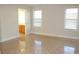 Spacious bedroom with tile floors and ensuite bathroom access at 321 Whitney Ln, Mcdonough, GA 30253