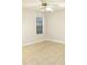 Bedroom with tile floors and a window with blinds at 321 Whitney Ln, Mcdonough, GA 30253