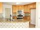 Kitchen boasts granite counters, wood cabinets, and an island at 321 Whitney Ln, Mcdonough, GA 30253