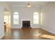 Living room with fireplace and large windows at 321 Whitney Ln, Mcdonough, GA 30253