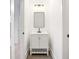 Modern bathroom with white vanity, black matte fixtures, and dark tile floor at 1240 Spalding Dr, Sandy Springs, GA 30350