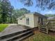 Side view of the house, highlighting the deck and patio at 2103 Mcafee Rd, Decatur, GA 30032