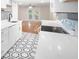 Modern kitchen with white cabinets, hexagon floor tile and stainless steel sink at 18 Ivy Ne Rdg, Atlanta, GA 30342