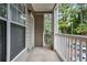 Private balcony with white railings and wooded views at 2700 Pine Tree Ne Rd # 2215, Atlanta, GA 30324
