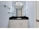 Bathroom with black countertop vanity and glass shelves at 2700 Pine Tree Ne Rd # 2215, Atlanta, GA 30324