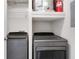 Laundry closet with Whirlpool washer and dryer at 2700 Pine Tree Ne Rd # 2215, Atlanta, GA 30324