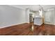Hardwood floor living room with an open concept kitchen and stainless steel appliances at 2700 Pine Tree Ne Rd # 2215, Atlanta, GA 30324