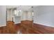 Open concept living room with hardwood floors and kitchen with stainless steel appliances at 2700 Pine Tree Ne Rd # 2215, Atlanta, GA 30324