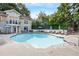 Community swimming pool with lounge chairs and umbrellas at 2700 Pine Tree Ne Rd # 2215, Atlanta, GA 30324