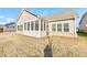 Home features a screened porch overlooking a grassy backyard at 2678 Songbird Ln, Grayson, GA 30017