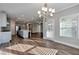 Bright dining room with hardwood floors and chandelier at 2678 Songbird Ln, Grayson, GA 30017