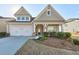 Attractive craftsman style home with a two car garage and manicured landscaping at 2678 Songbird Ln, Grayson, GA 30017