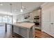 Modern kitchen with stainless steel appliances and an island at 2678 Songbird Lane, Grayson, GA 30017