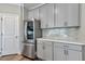 Gray cabinets and quartz countertops in this modern kitchen at 2678 Songbird Ln, Grayson, GA 30017