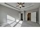 Large main bedroom with ceiling fan and carpeted floor at 2678 Songbird Ln, Grayson, GA 30017