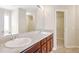 Double vanity bathroom with walk-in closet at 2070 Bonny Glen Cir, Austell, GA 30106