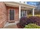Dark brown front door and brick facade with welcoming landscaping at 2070 Bonny Glen Cir, Austell, GA 30106